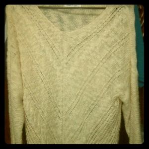 A white cream sweater